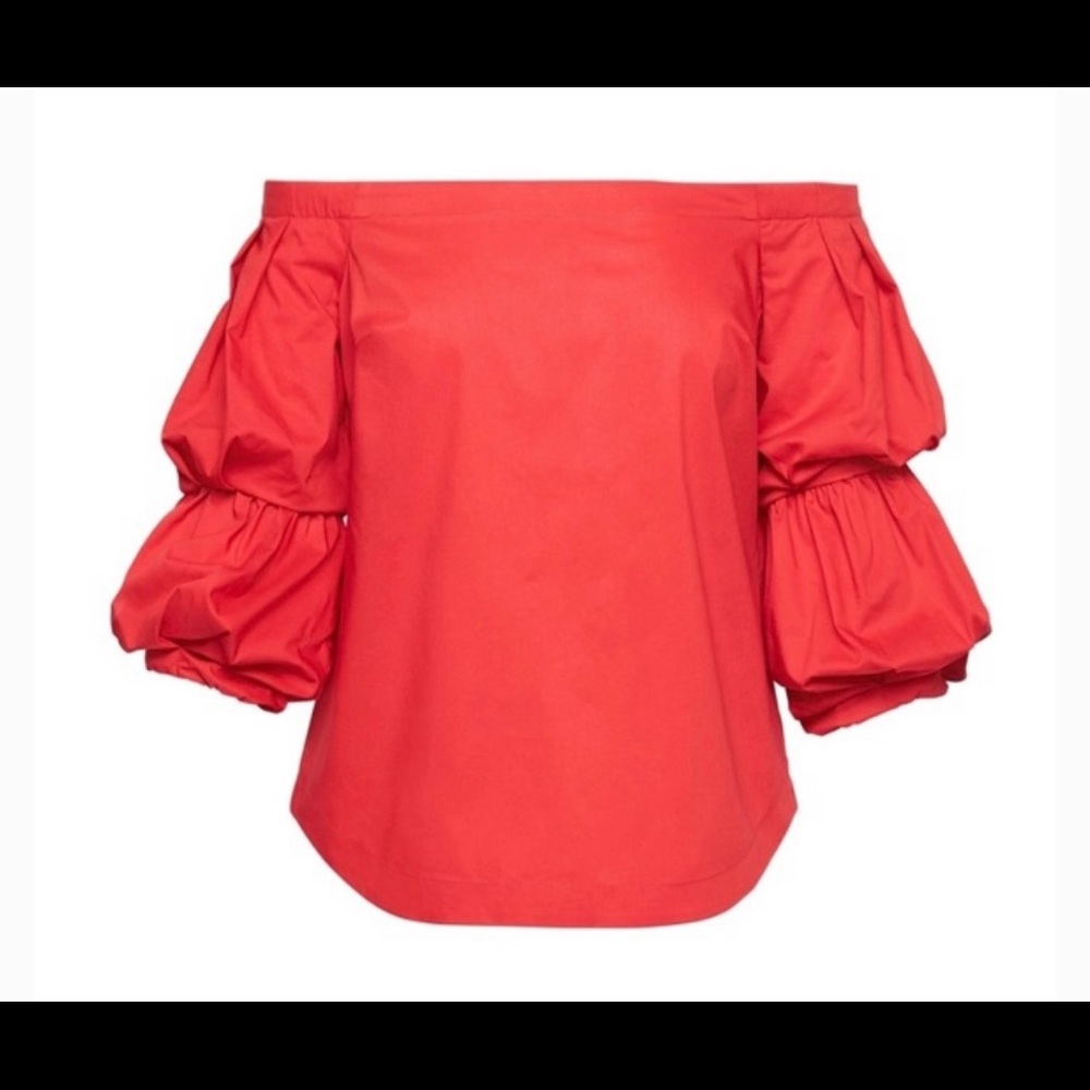 Women’s blouse is off-the-shoulder and a rich red color.